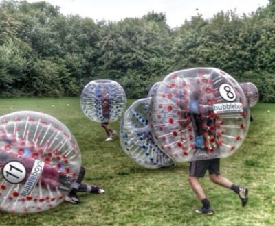 people in essex playing zorb and bubble football