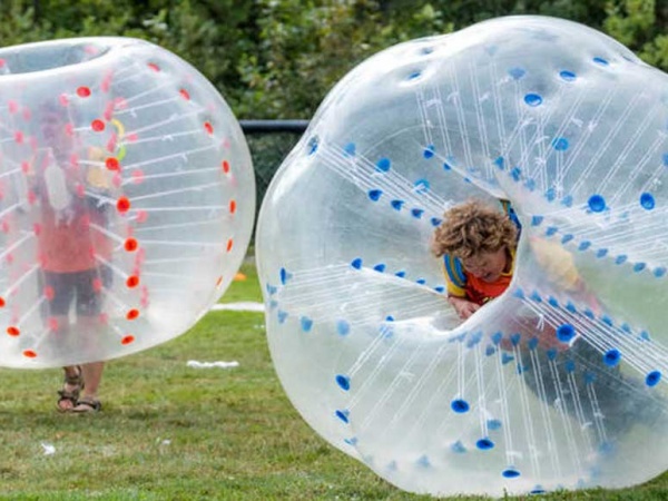 2 inflatable bubble balls on grass